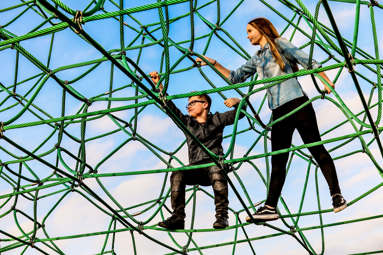 Illustration of two children climbing on the spiders web at Telford Town Park